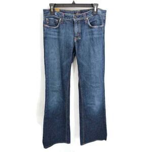Lo Fli medium wash Low Rise boot cut jeans in size 31 Long.